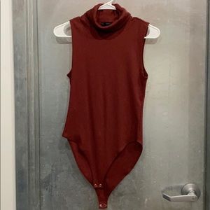 Sleeveless mock turtle body suit